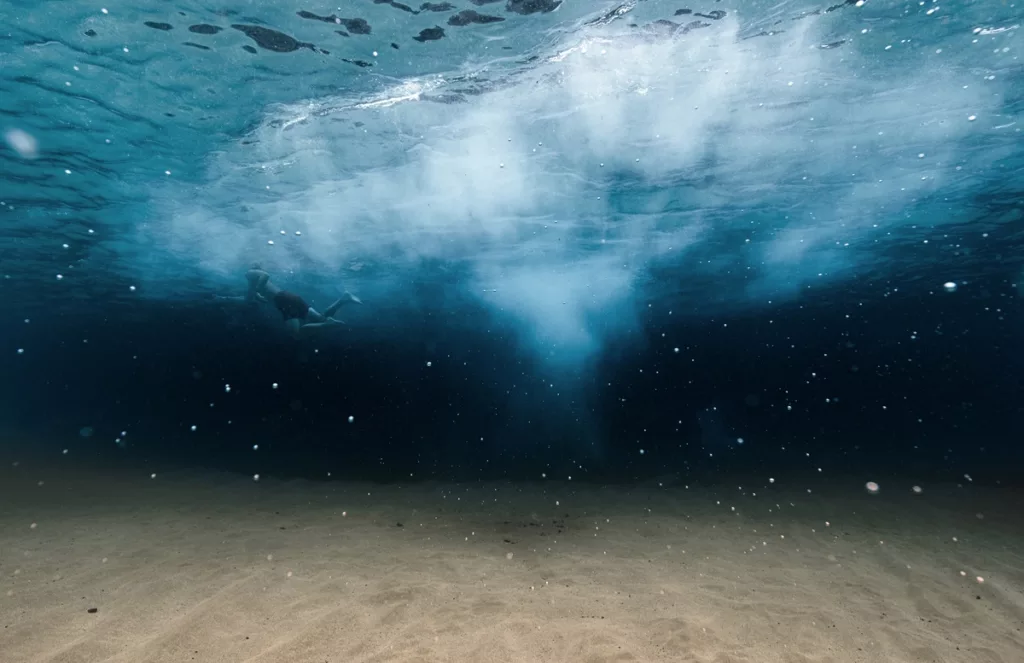 Person wading calmly inside of the ocean